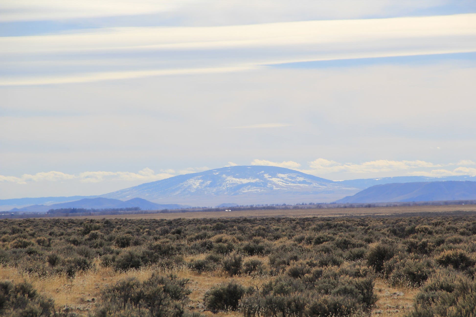 Scenic land featuring panoramic mountain vistas.